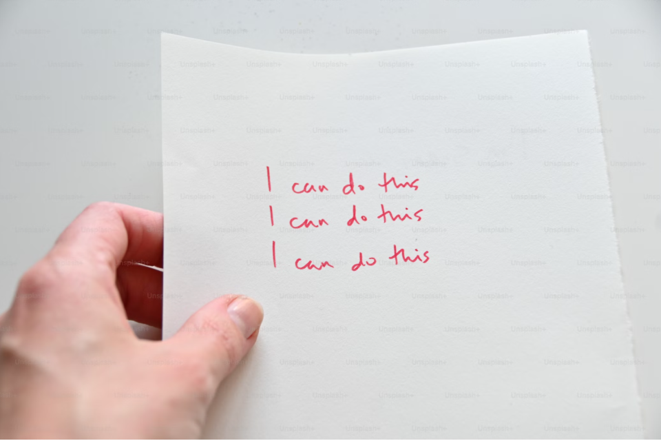Writing on a page that repeats the phrase, "I can do this."